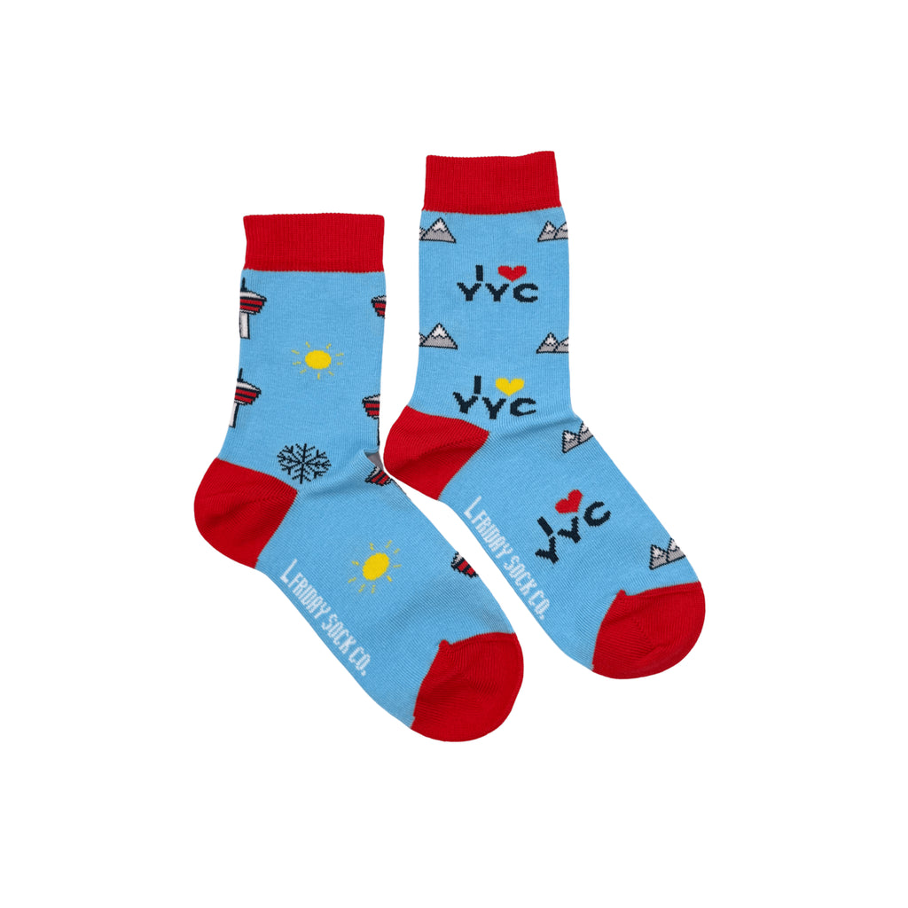 Mismatched socks for kids with Calgary-inspired patterns – cozy, stylish, and full of hometown pride!