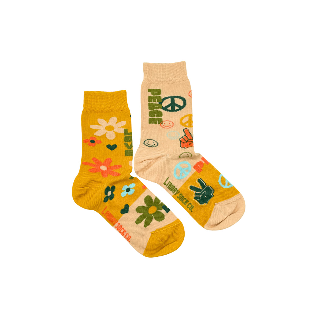 Mismatched socks for kids with vibrant peace and love patterns – perfect for little free spirits.