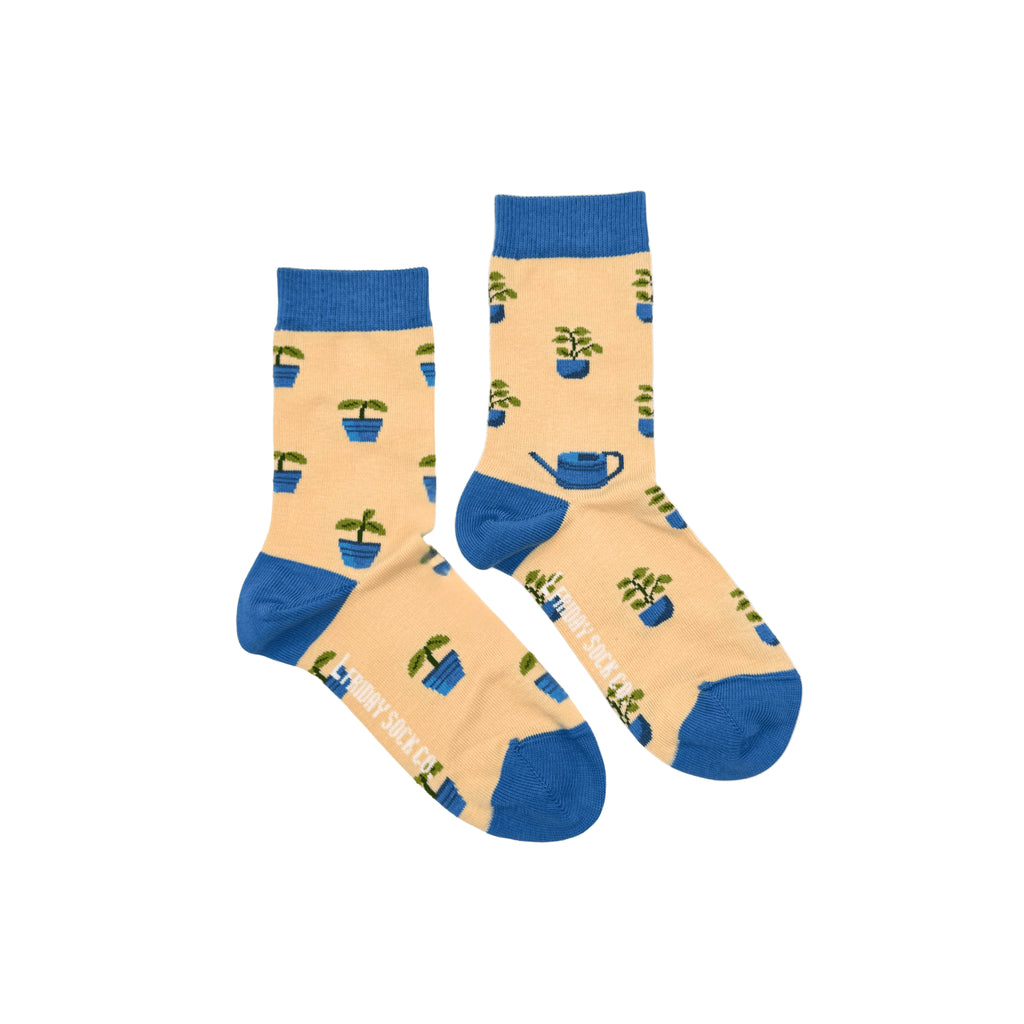 Bright and playful kids’ socks featuring mismatched plant patterns, perfect for little explorers.