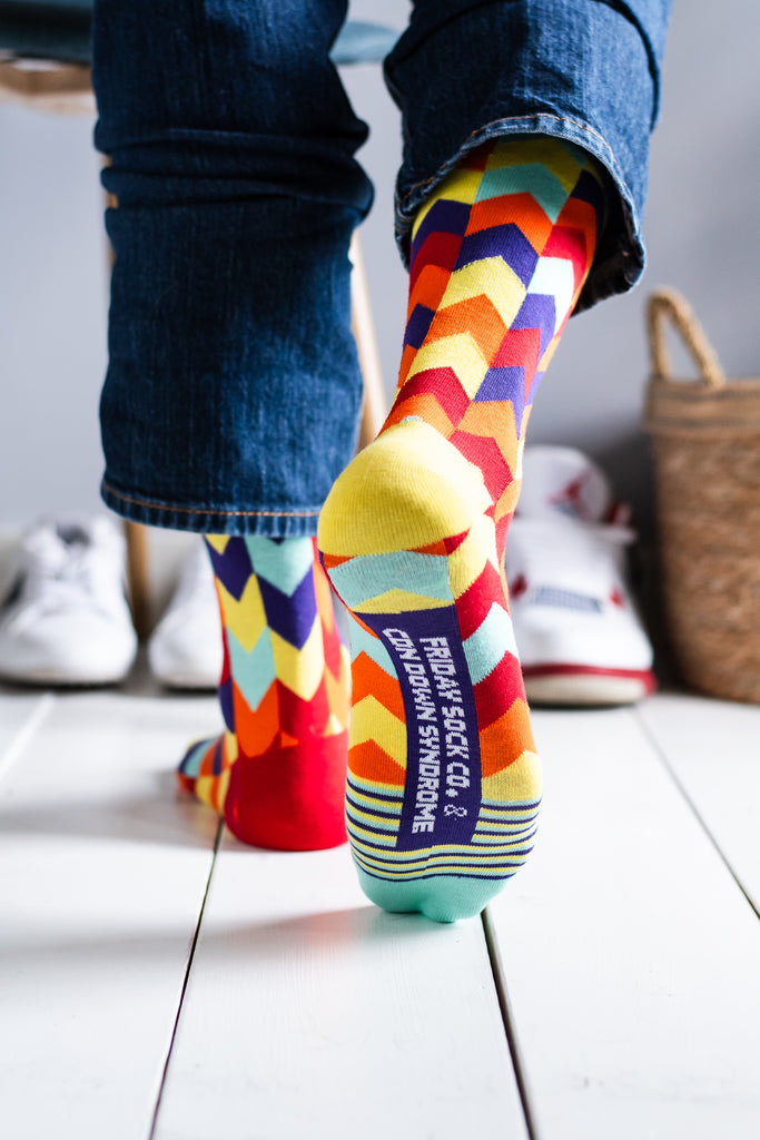 Men’s mismatched chevron socks supporting the Canadian Down Syndrome Society – bold and meaningful.