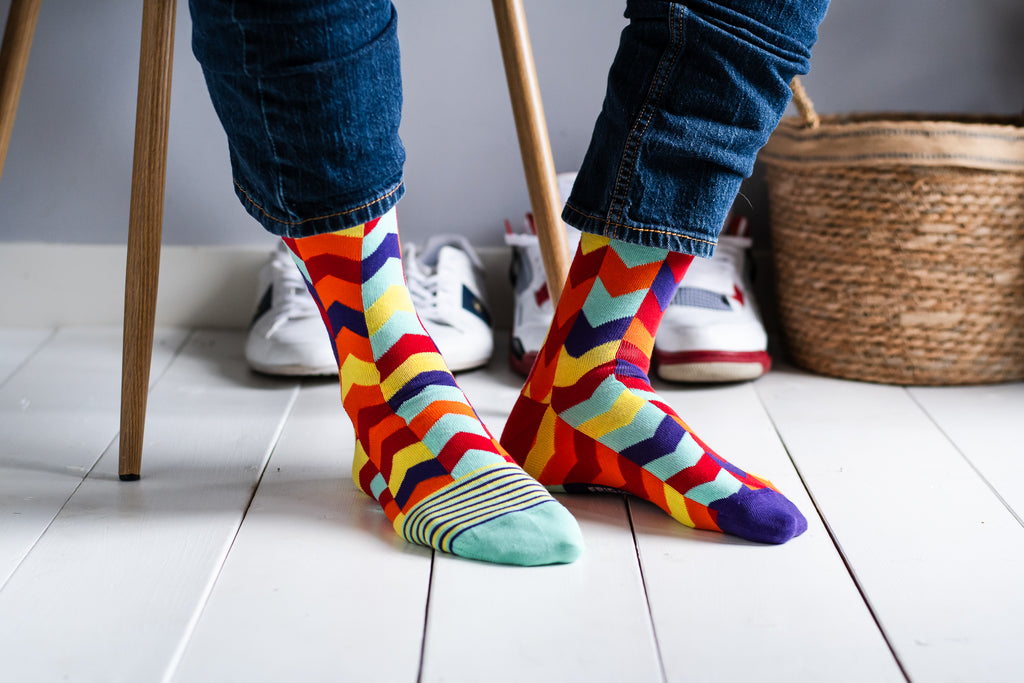 Men’s mismatched chevron socks supporting the Canadian Down Syndrome Society – bold and meaningful.